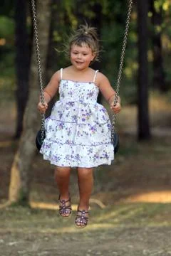 Swinging child Stock Photos