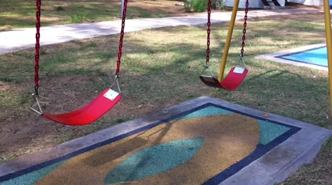 Swinging cradle  at the playground, loop (swings swaying) Stock Footage 41315131