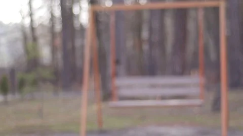 Swinging empty swing in the forest park Stock Footage 74065623