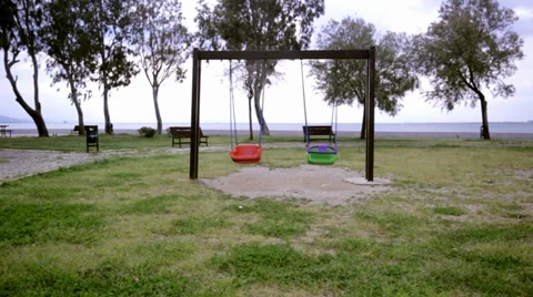 Swinging Empty Swings Stock Footage 33668544