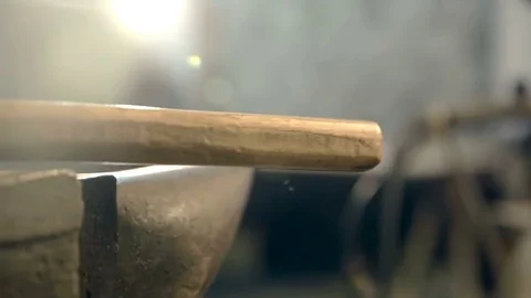 Swinging hammer on the anvil Stock Footage 76396296