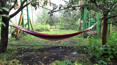 SWINGING HAMMOCK (AN EMPTY) Stock Footage 58772347