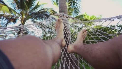 Swinging in a hammock, feets. Stock Footage 81487368