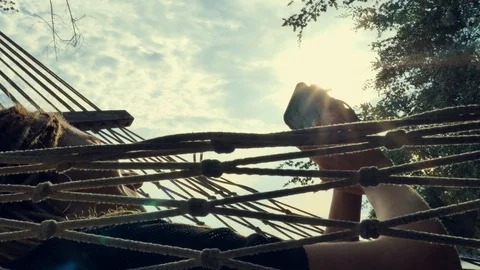 Swinging in a hammock Stock Footage 129302514