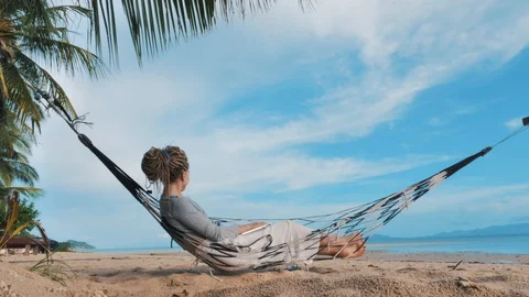 Swinging in a hammock Stock Footage 129302899