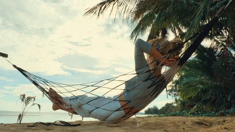Swinging in a hammock Stock Footage 129303314