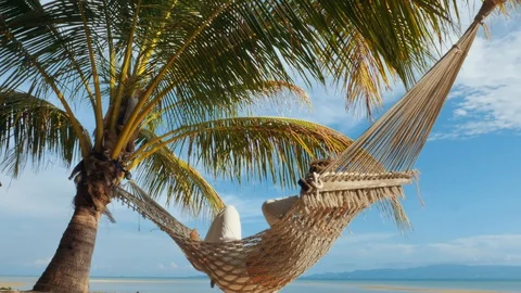 Swinging in a hammock Stock Footage 129320942