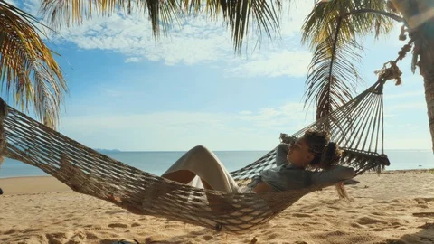 Swinging in a hammock Stock Footage 129322118