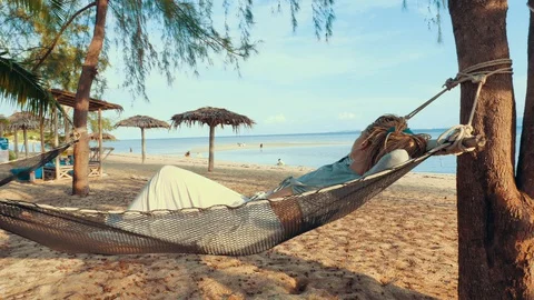 Swinging in a hammock Stock Footage 129322186