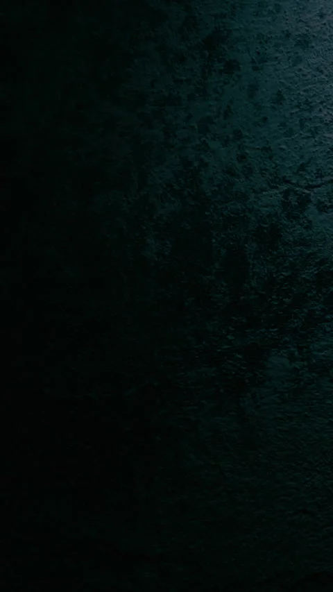 Swinging lamp light casts blue tones on textured wall background 스톡 동영상 330970187