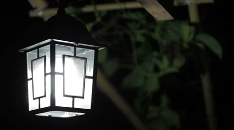 Swinging lamp at night Stock Footage 51104134