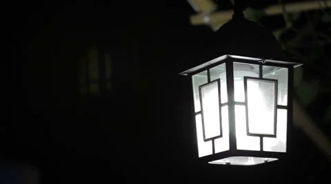 Swinging lamp at night Stock Footage 51111258