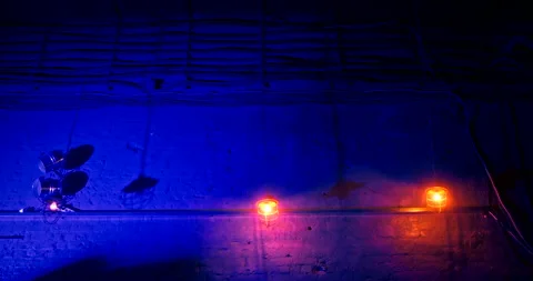 Swinging lanterns suspended from long chains in nightclub against a brick wall. Stock Footage 172314953