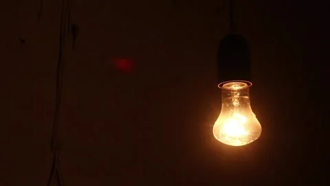 Swinging Light Bulb in a Loop Stock Footage 234814924
