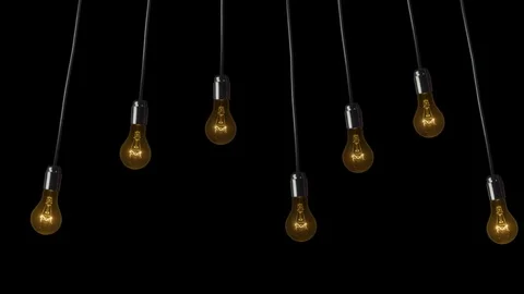 Swinging light bulbs a black background Stock Footage 86363697