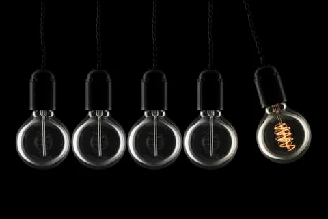 Swinging lightbulb Stock Photos