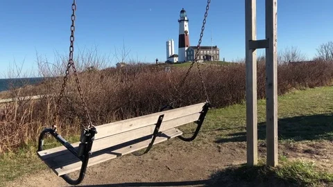 Swinging by the Lighthouse Stock Footage 83056645