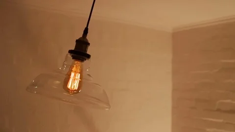 Swinging loft style ceiling light Video stock 85340632