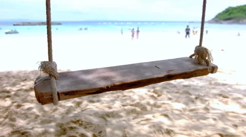 Swinging motion on the beach Stock Footage 58334582