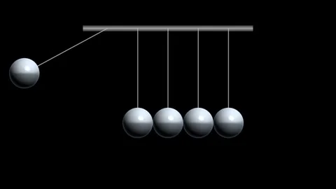 Swinging Newton cradle demonstrating conservation of momentum and energy on Stock Footage 334931106