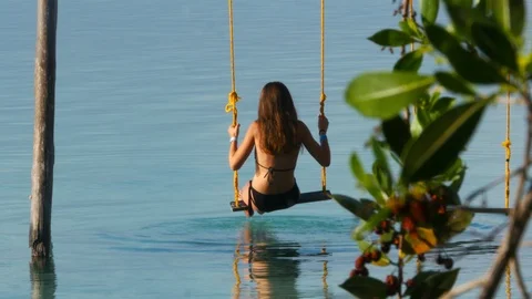Swinging over the water Stock Footage 94622046