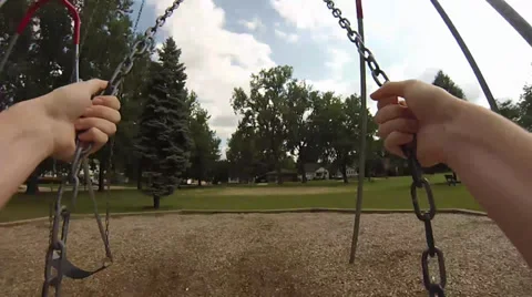 Swinging in a park Stock Footage 35114043