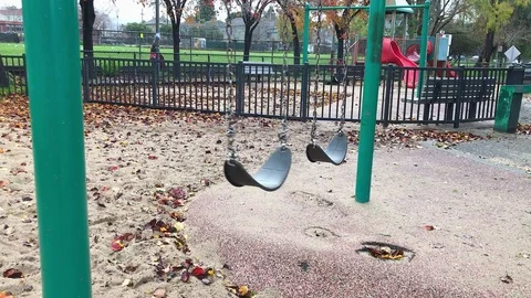 Swinging in park 動画素材 71897478