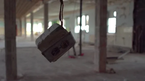 Swinging Plug in Abandoned Building Stock Footage 72295598