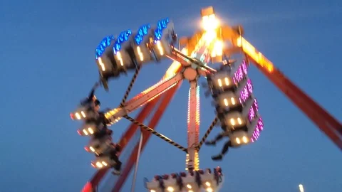Swinging ride at the evening Funfair Stock Footage 93866860