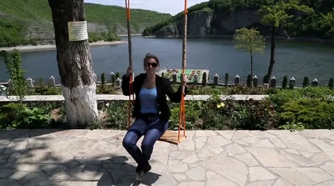 Swinging on a swing Stock Footage 55781458