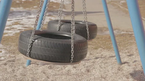 Swinging swing made of tire Stock Footage 33753559