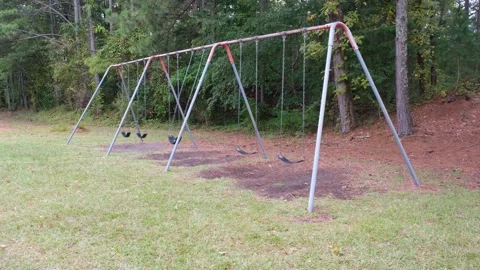 Swinging swing set at the park Stock Footage 146035915