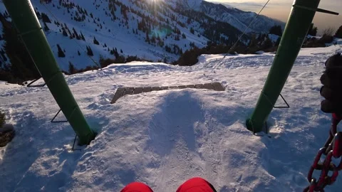 Swinging on a swing with sunset and mountain views Vídeos de archivo 229931010