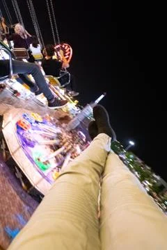 Swinging in theme park at fully lights night Stock Photos