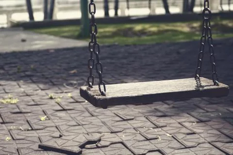 Swings in black and empty. Stock Photos