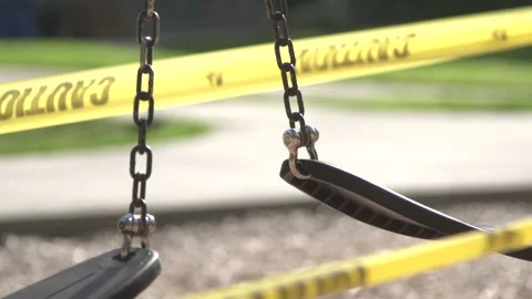 Swings with caution tape Stock Footage 165301576