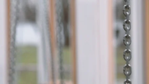 Swings` chain with a blurry background Stock Footage 125856879
