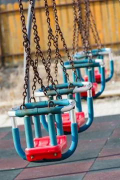 Swings in the park with chains Stock Photos