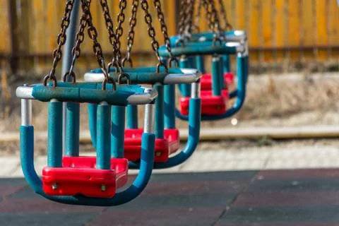 Swings in the park with chains Stock Photos