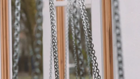 Swings from a side view with focus change on chains close up Stock Footage 125856859