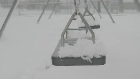 Swings in the snow Stock Footage 221773579