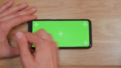 Swipe scrolling gesture on chroma key of modern smartphone touch phone in g.. Stock Footage 272779621