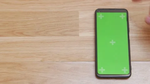 Swipe scrolling gesture on chroma key of modern smartphone touch phone in green Video stock 336249281