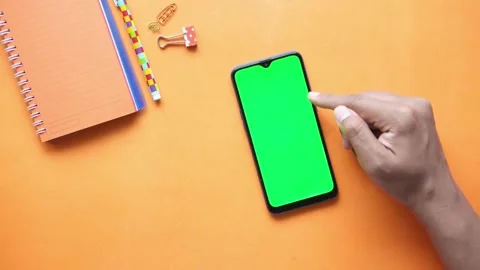 Swipe scrolling gesture on chroma key of modern smartphone touch phone in green Video stock 336249295