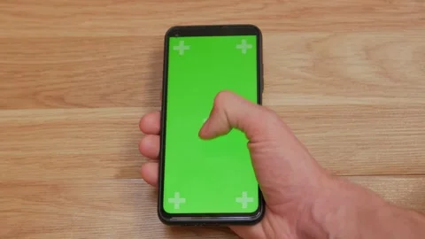 Swipe scrolling gesture on chroma key of modern smartphone touch phone in green Video stock 336249474