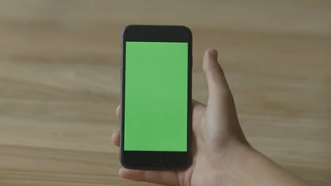 Swipe on a Smart Phone, Touch Screen, Held By Hands. Chroma Key. Close Up. Stock Footage