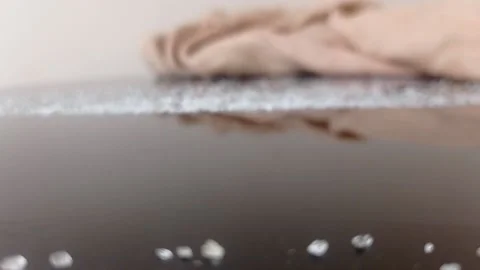 Swiping sugar on a table with a tissue Stock Footage 146255386