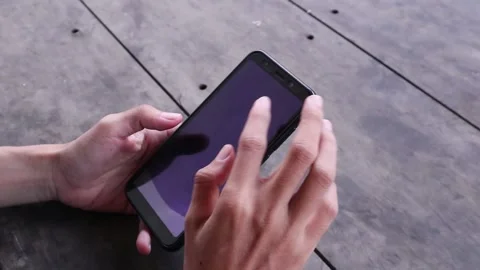 Swiping, typing and scrolling on his smartphone Stock Footage 238655751