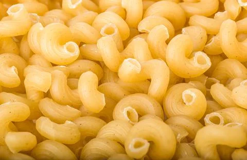 Swirled macaroni background Stock Photos