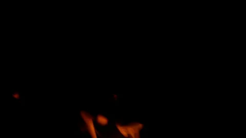 The swirling and dancing flames set against a dark background create a captivati Stock Footage 311814778
